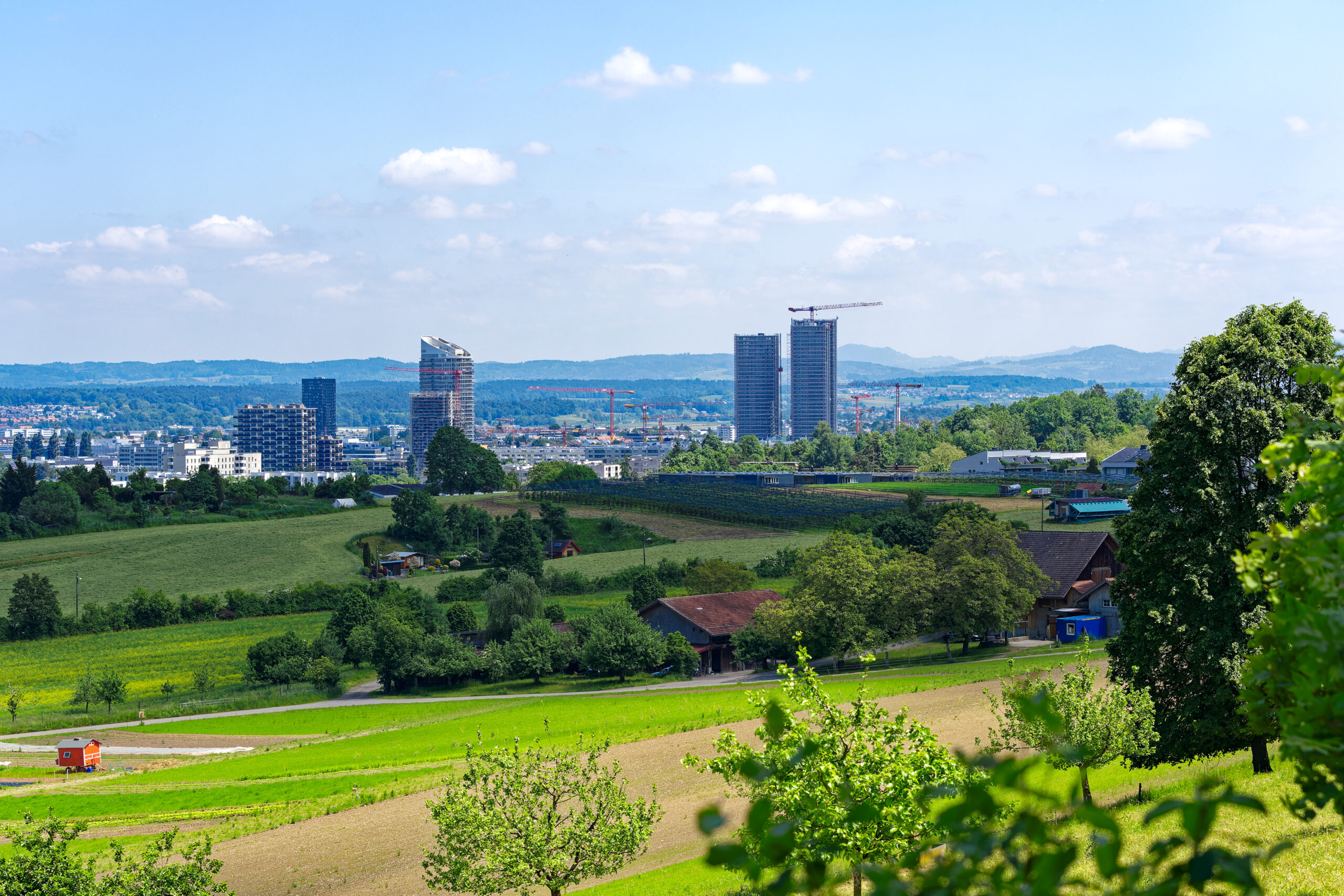 Scenic landscape with Glatt Valley and skyline of Dübendorf Stettbach in the background on a sunny spring day. Photo taken May 26th, 2023, Zurich, Switzerland. Dübendorf